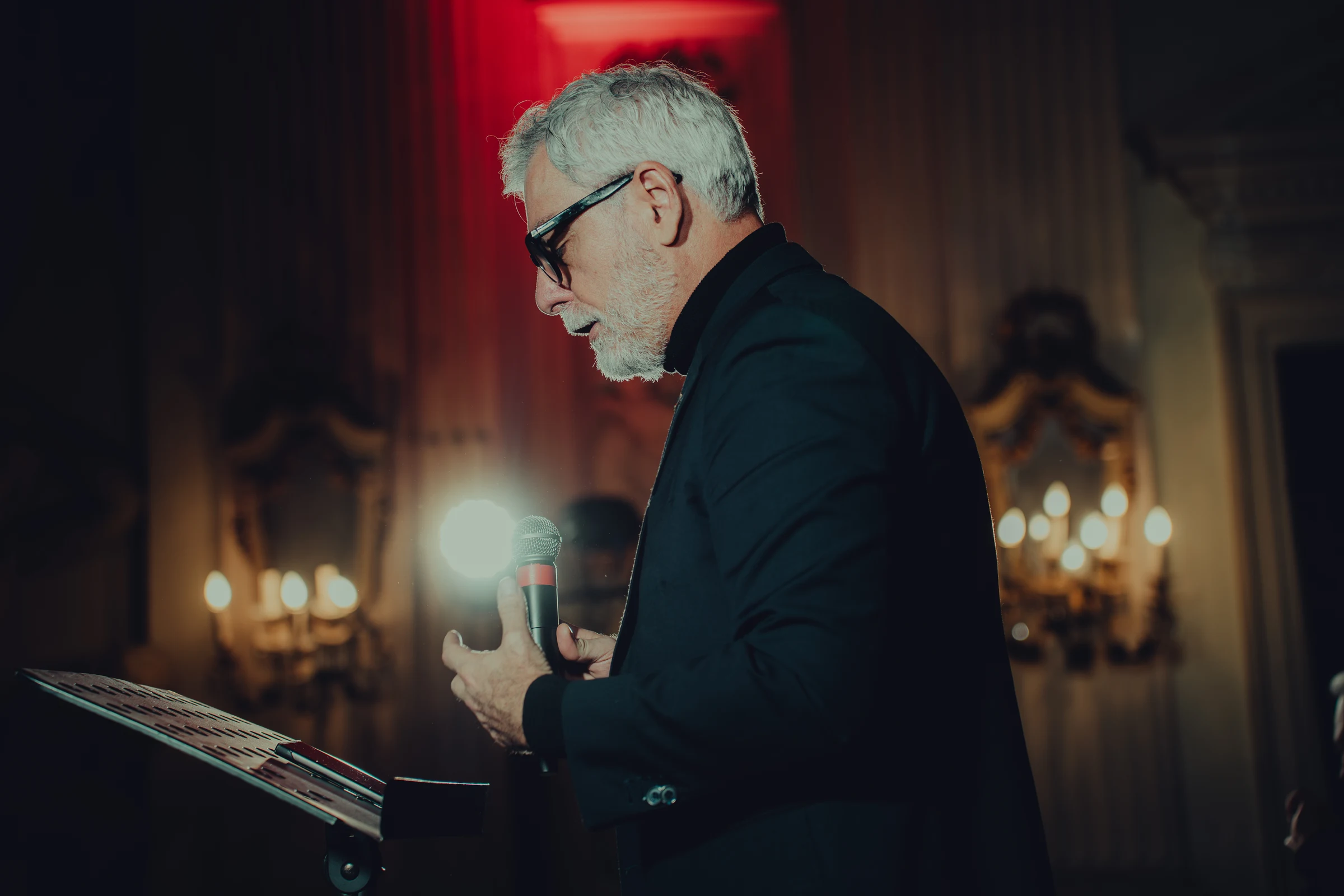 Speaker holding a microphone at a Torino Film Industry event