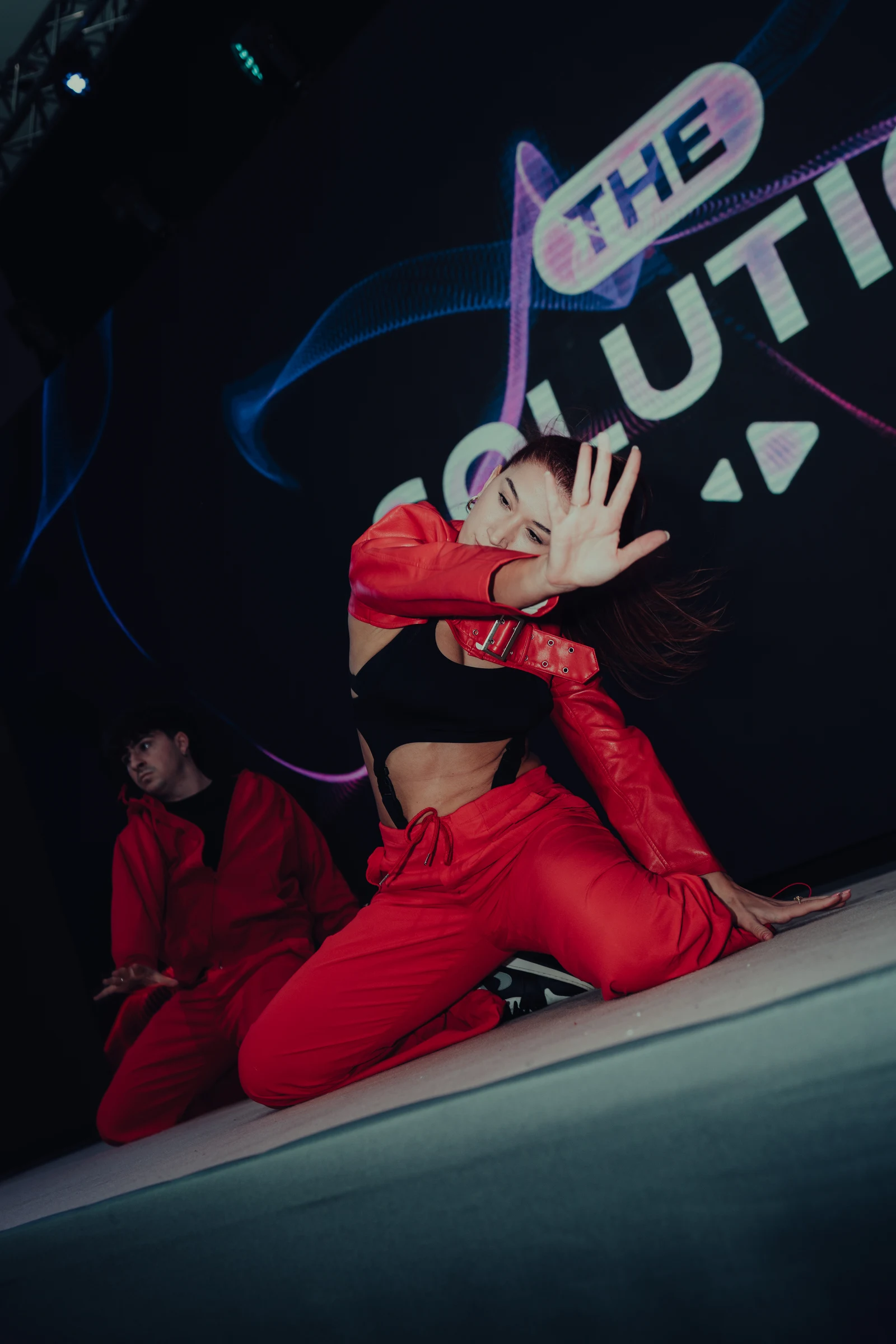 Performer dressed in red during a stage show