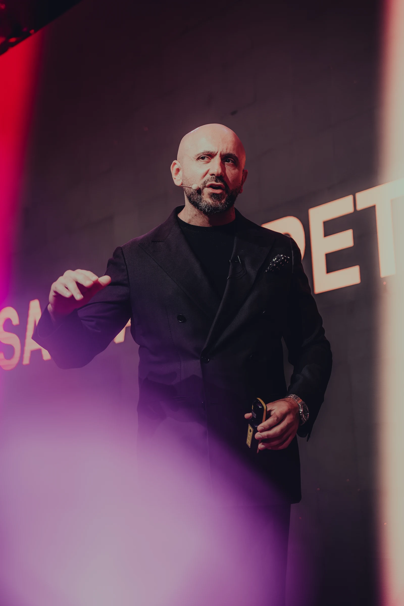 Speaker standing on an illuminated stage