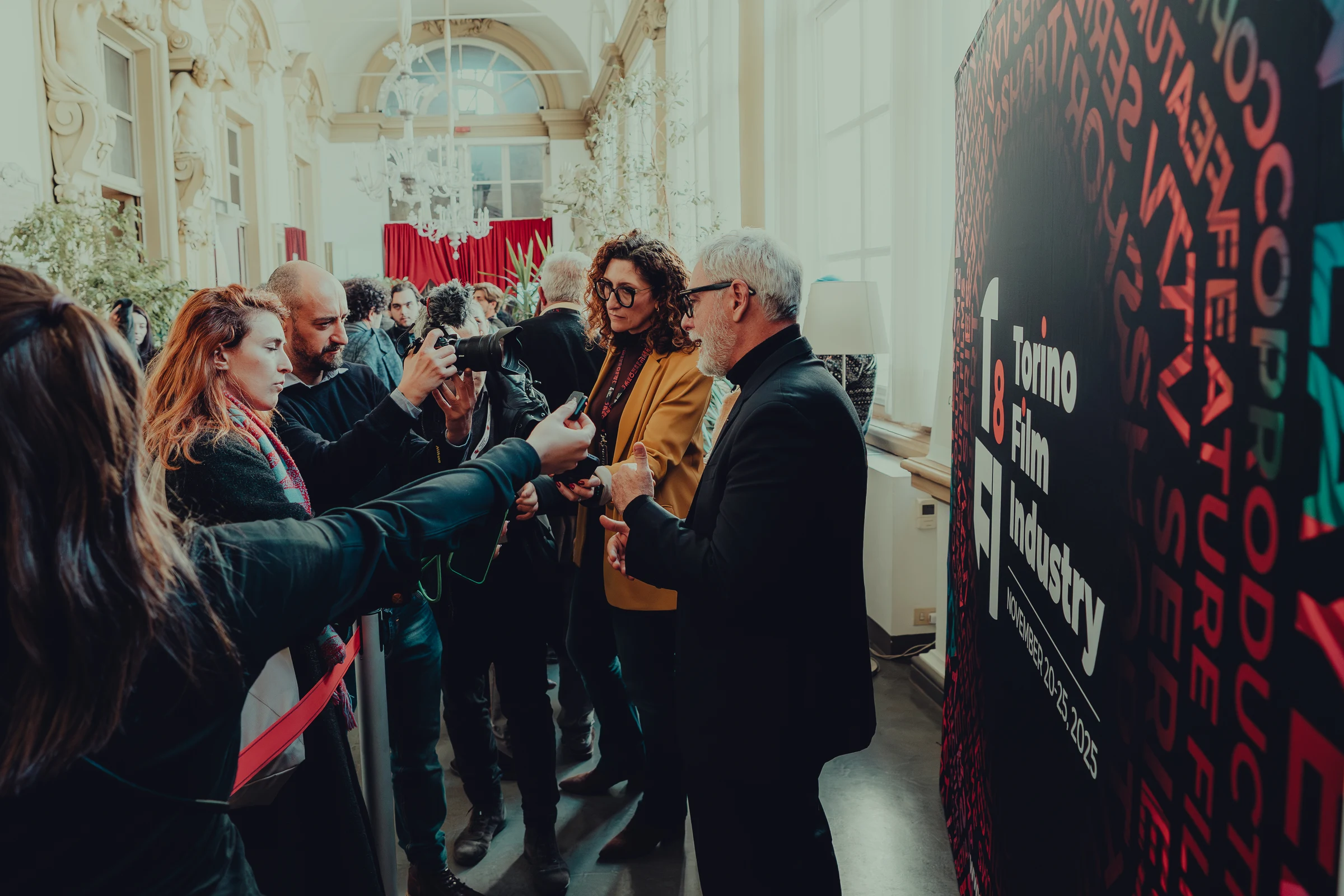 Red carpet interview in front of an audience
