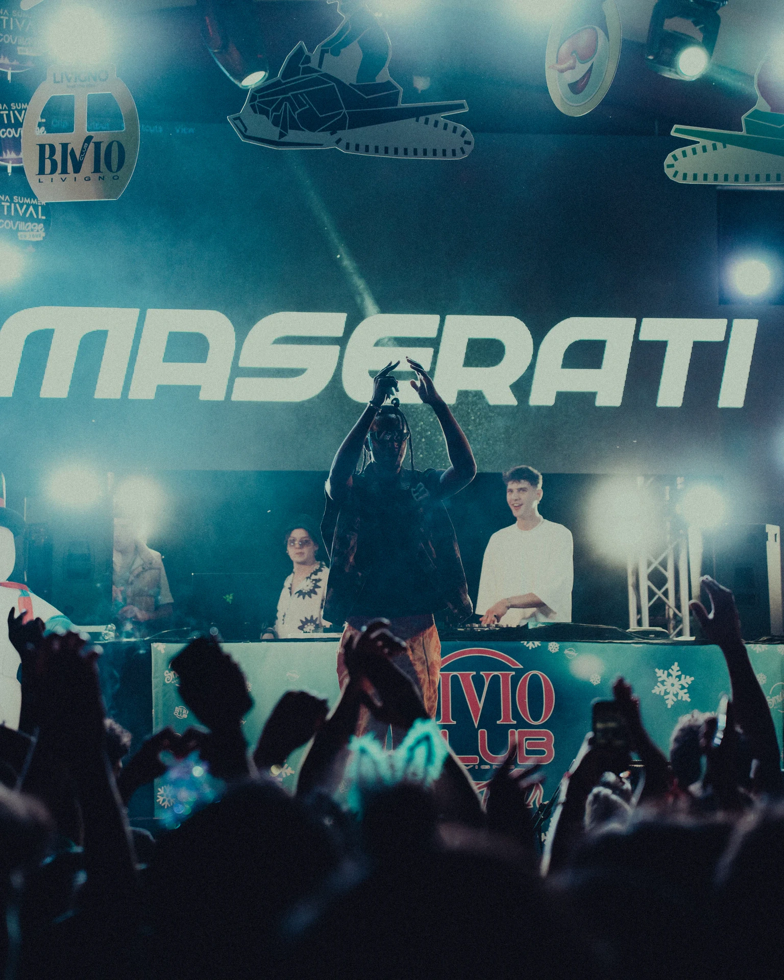Audience facing a stage at an automotive event