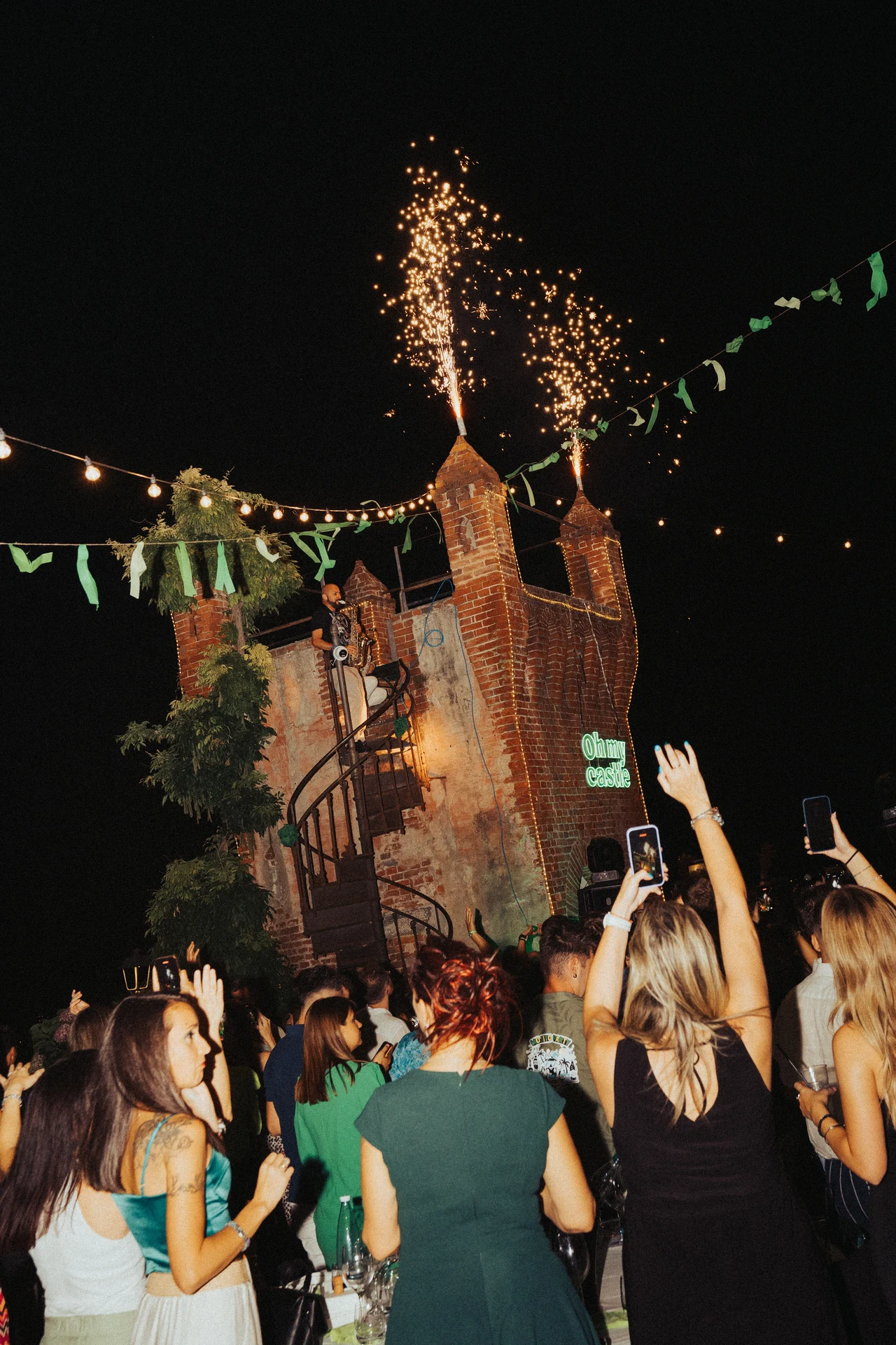 Crowd celebrating at an outdoor night event