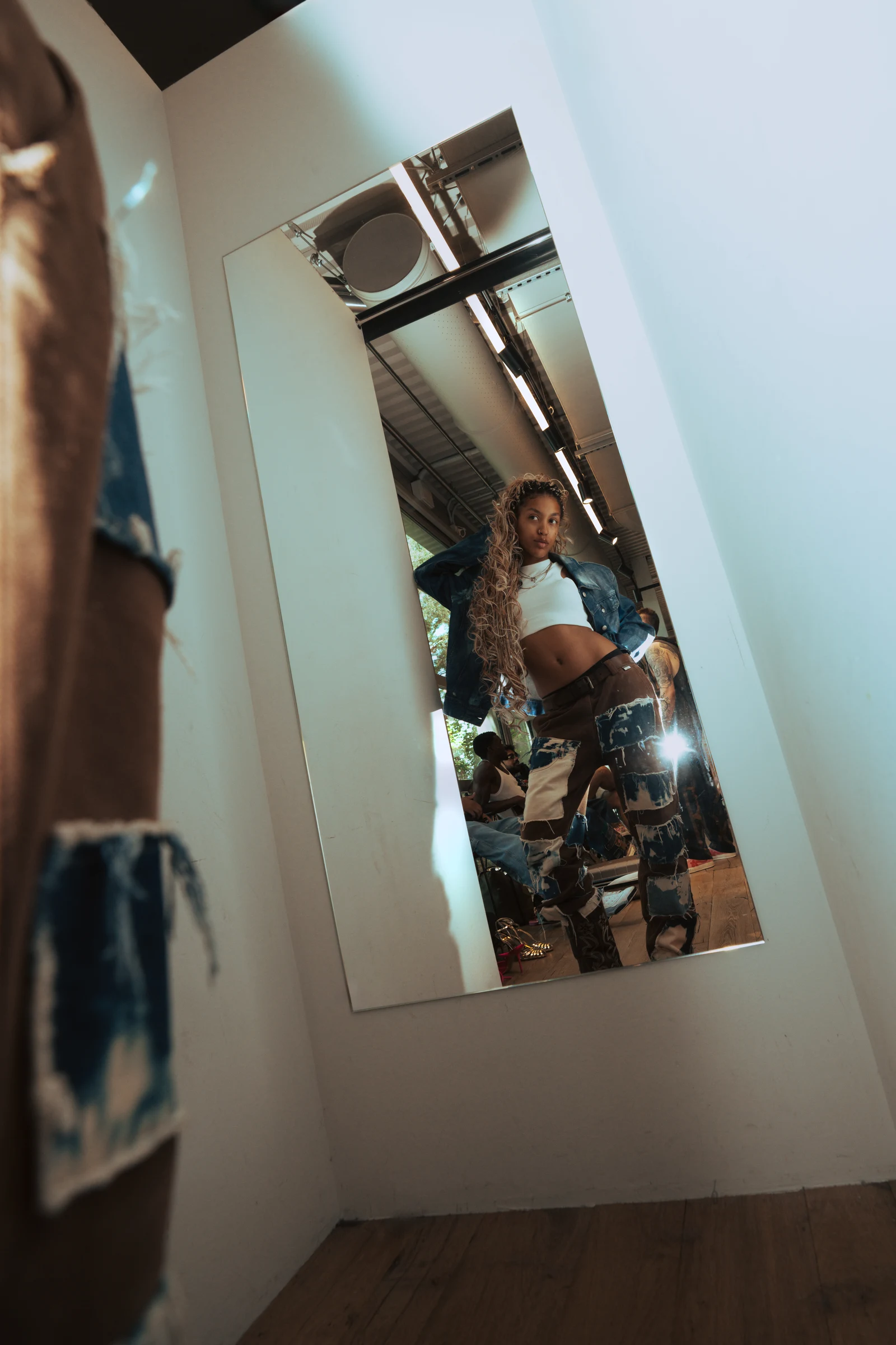Fashion silhouette photographed through a mirror