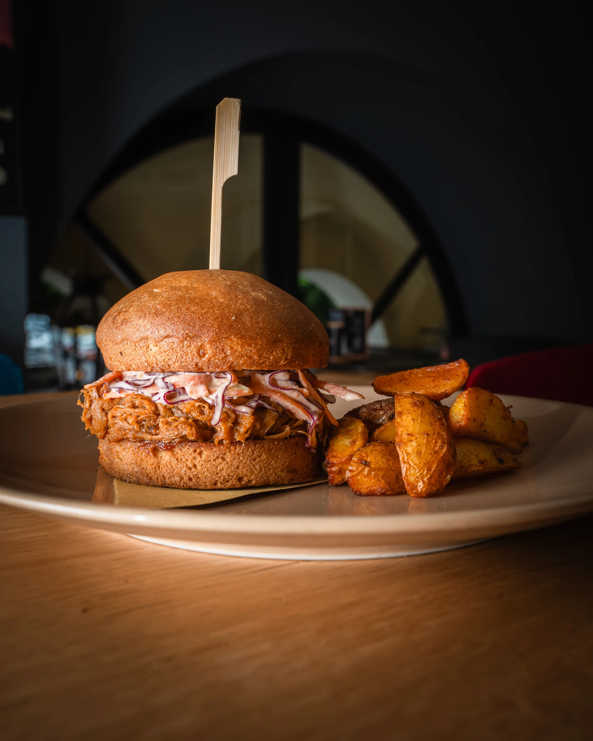 Gourmet burger served with potatoes