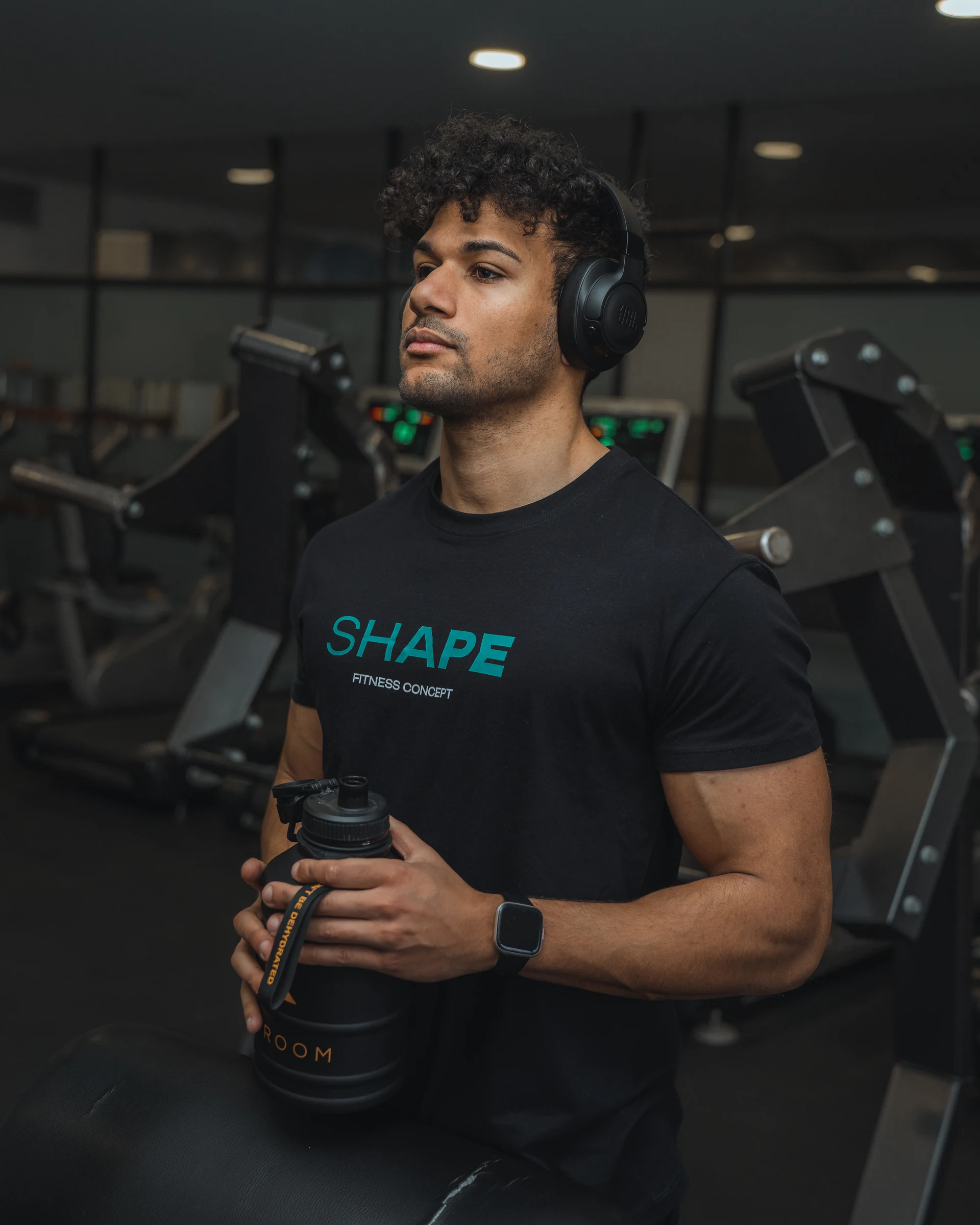 Fitness coach holding a kettlebell in a gym