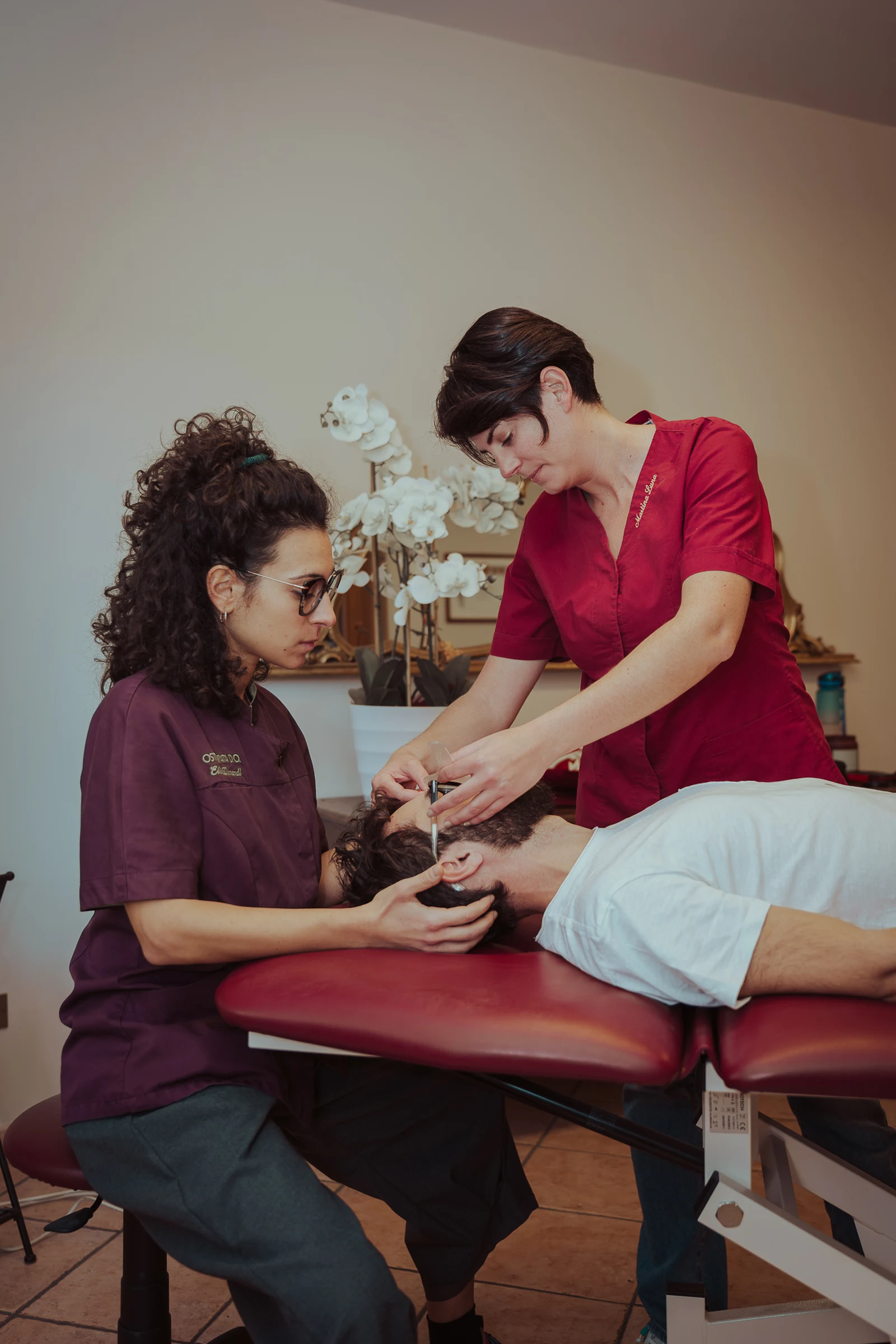 Beauty professionals carrying out a treatment for a client