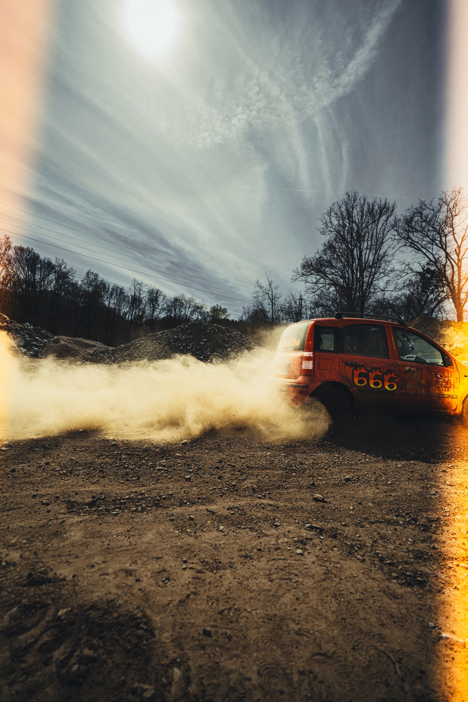 Rally car raising a cloud of dust