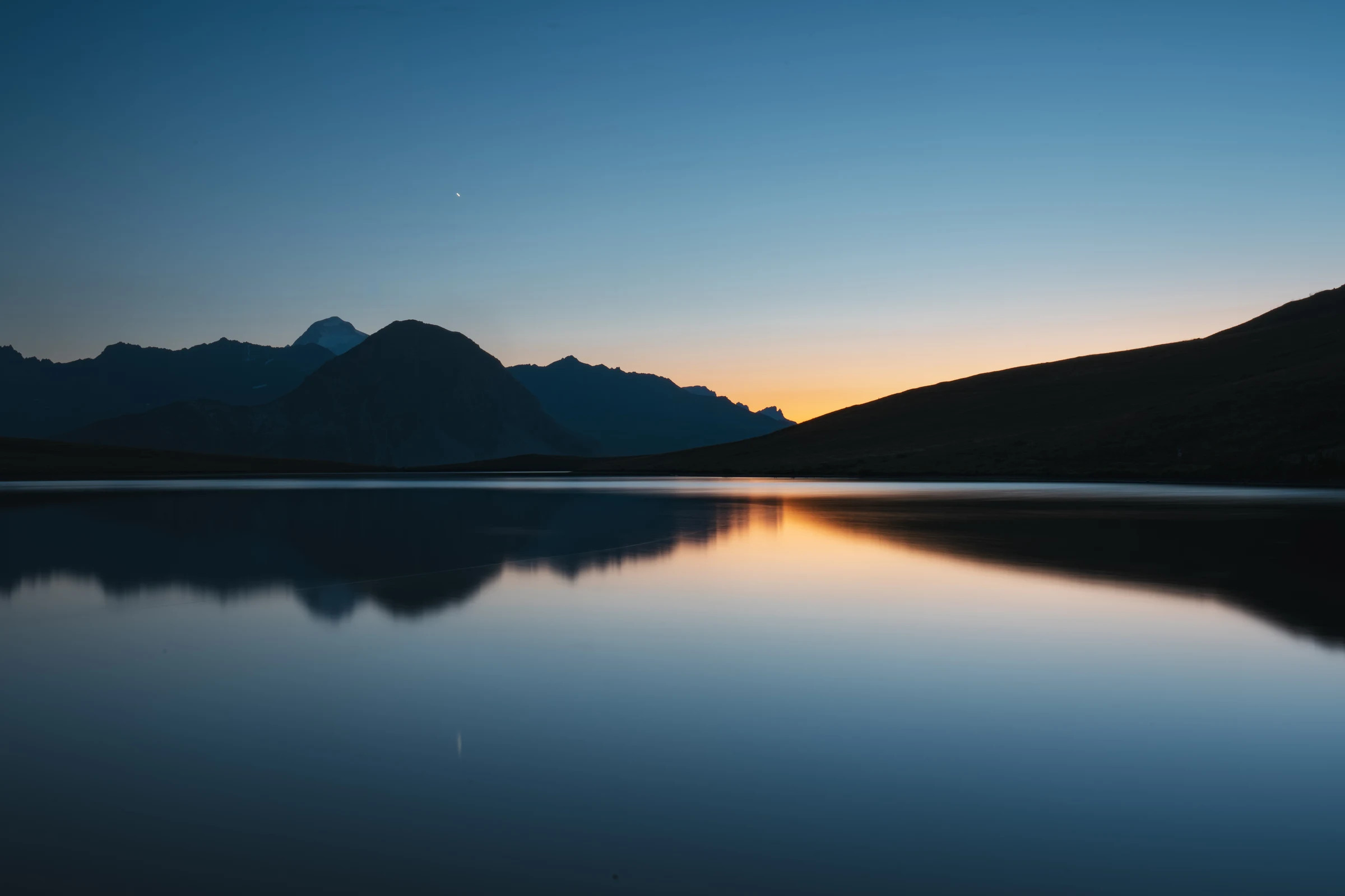 Sunset reflected in Lake Ouillette in Val d’Isère