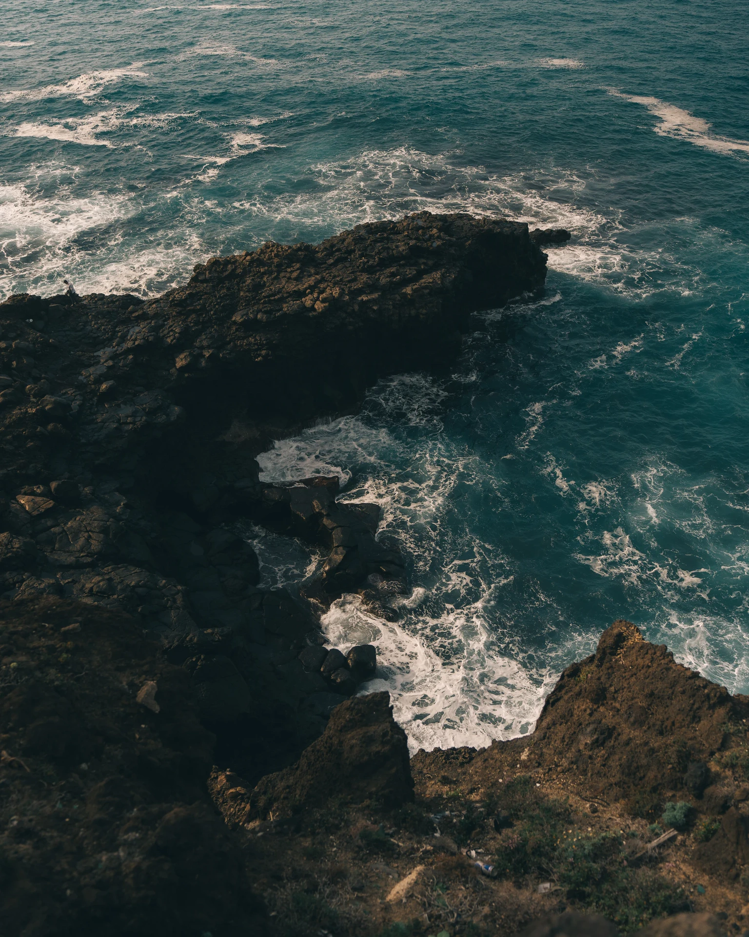 Waves breaking along a rocky coast